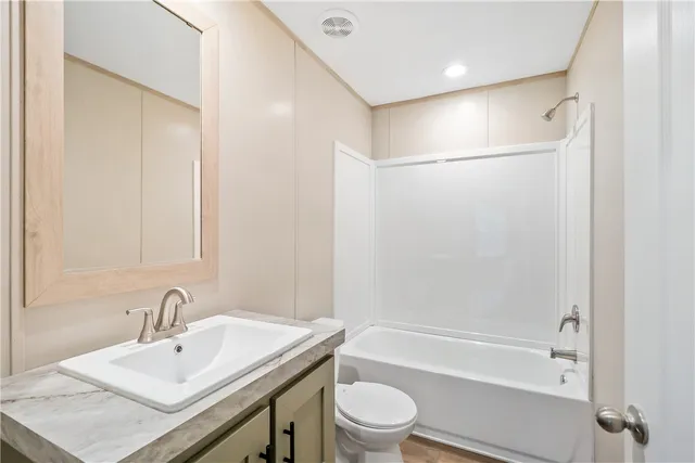 a view of a livingroom with a kitchen