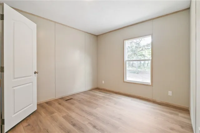 a bathroom with a glass door shower