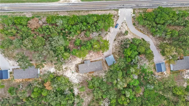a view of a house with a flower garden