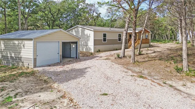 a view of a porch with wooden floor and outdoor space