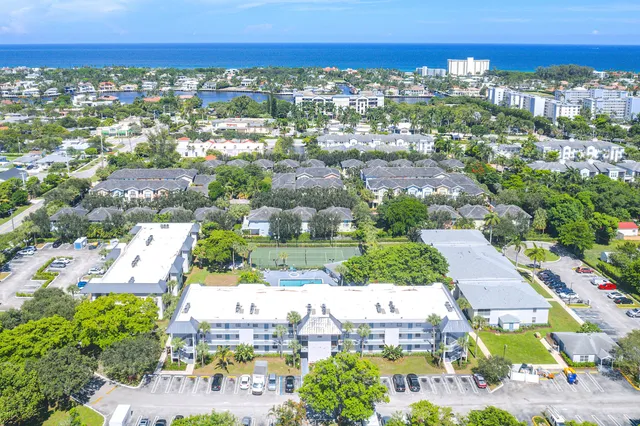 an aerial view of residential houses with outdoor space