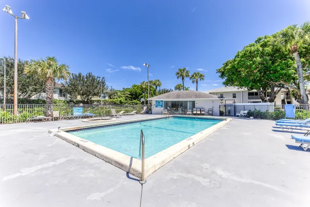 a view of a swimming pool and a chairs