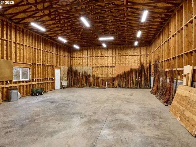 a view of an empty room with wooden fence