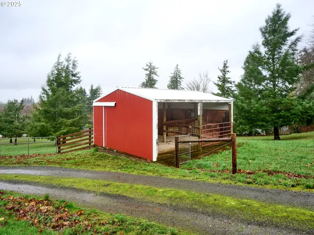 a view of a house with a yard and sitting area