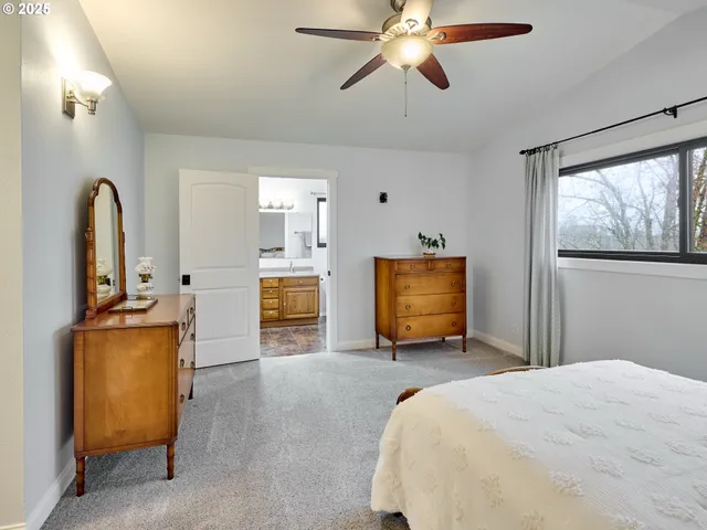 a bedroom with bed and window