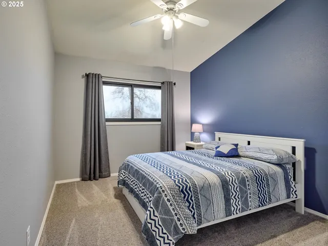 a bedroom with a bed and window