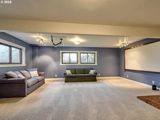 a view of livingroom with furniture and a window