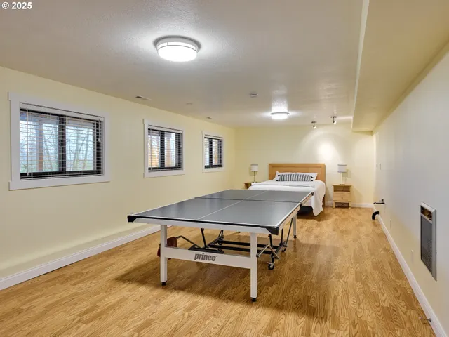 a bedroom with a bed and a night stand