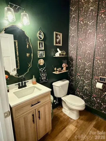 a view of an empty room and wooden floor