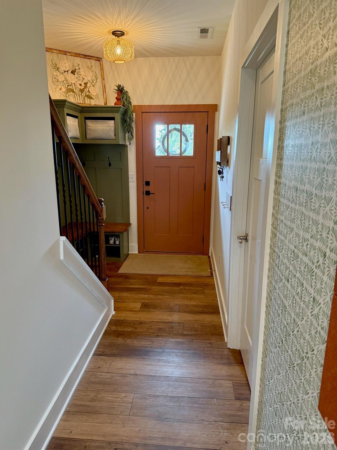 526 Cardwell Lane Fletcher, NC 28732 - Photo 17 of 37 a view of a hallway with wooden floor and staircase