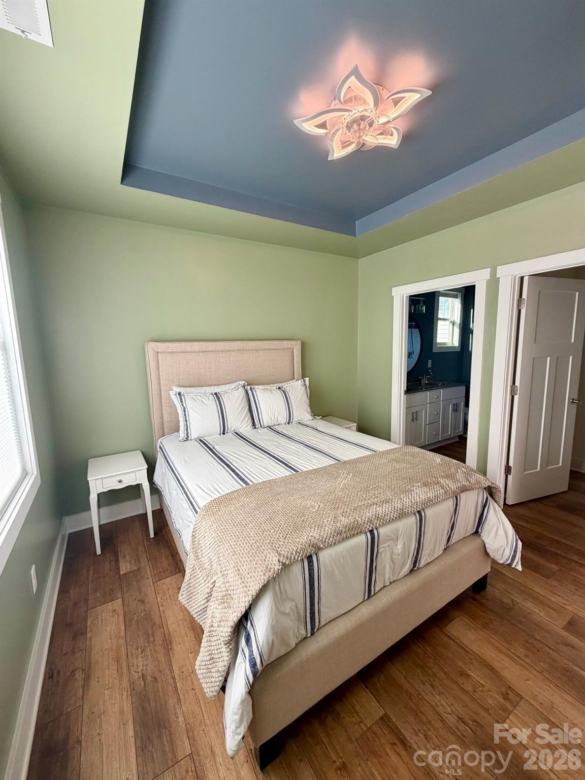 526 Cardwell Lane Fletcher, NC 28732 - Photo 18 of 37 a bedroom with a bed and a chandelier