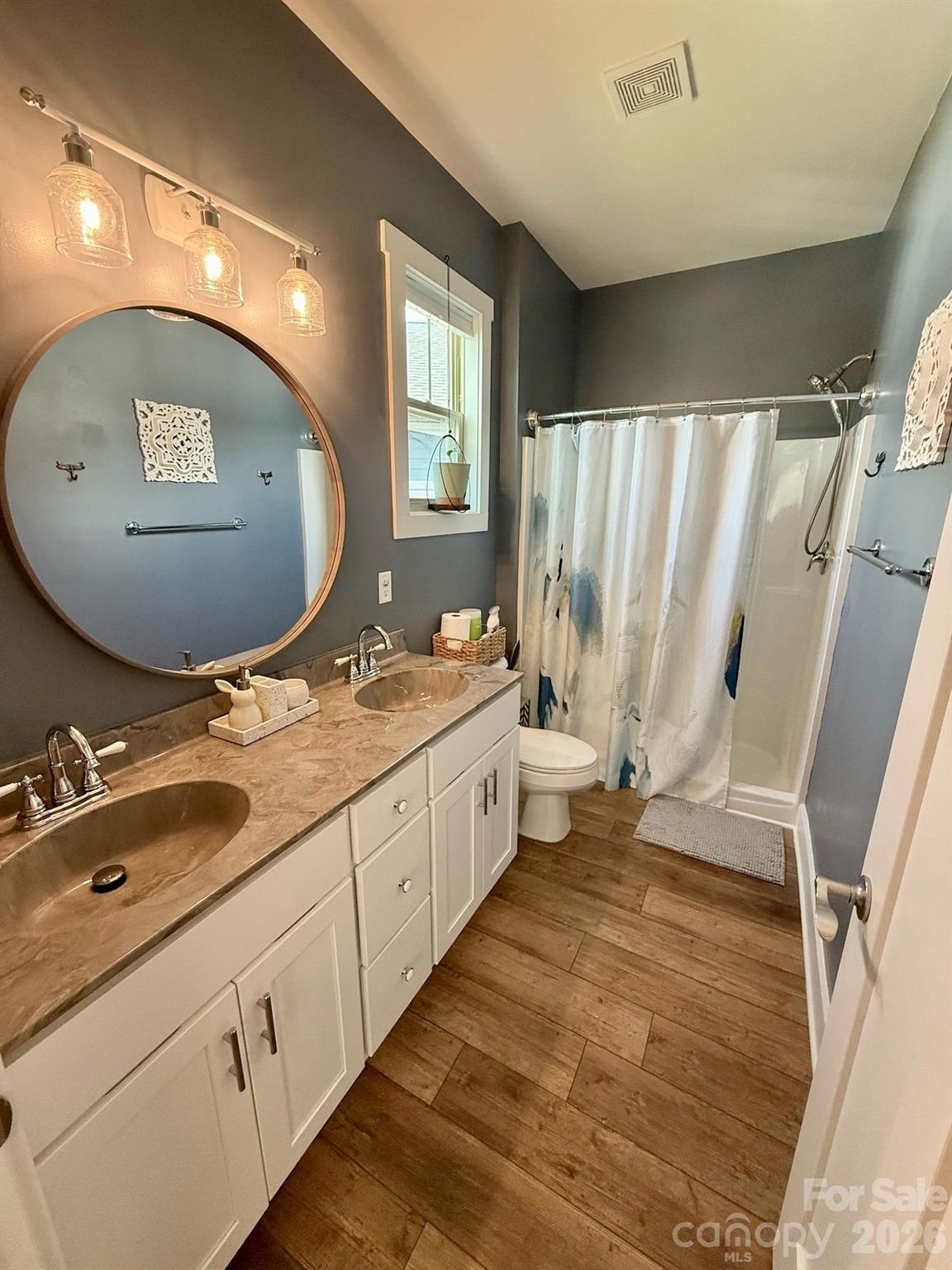 526 Cardwell Lane Fletcher, NC 28732 - Photo 20 of 37 a bathroom with a double vanity sink and a mirror