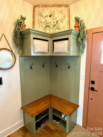 a living room with a washer and dryer