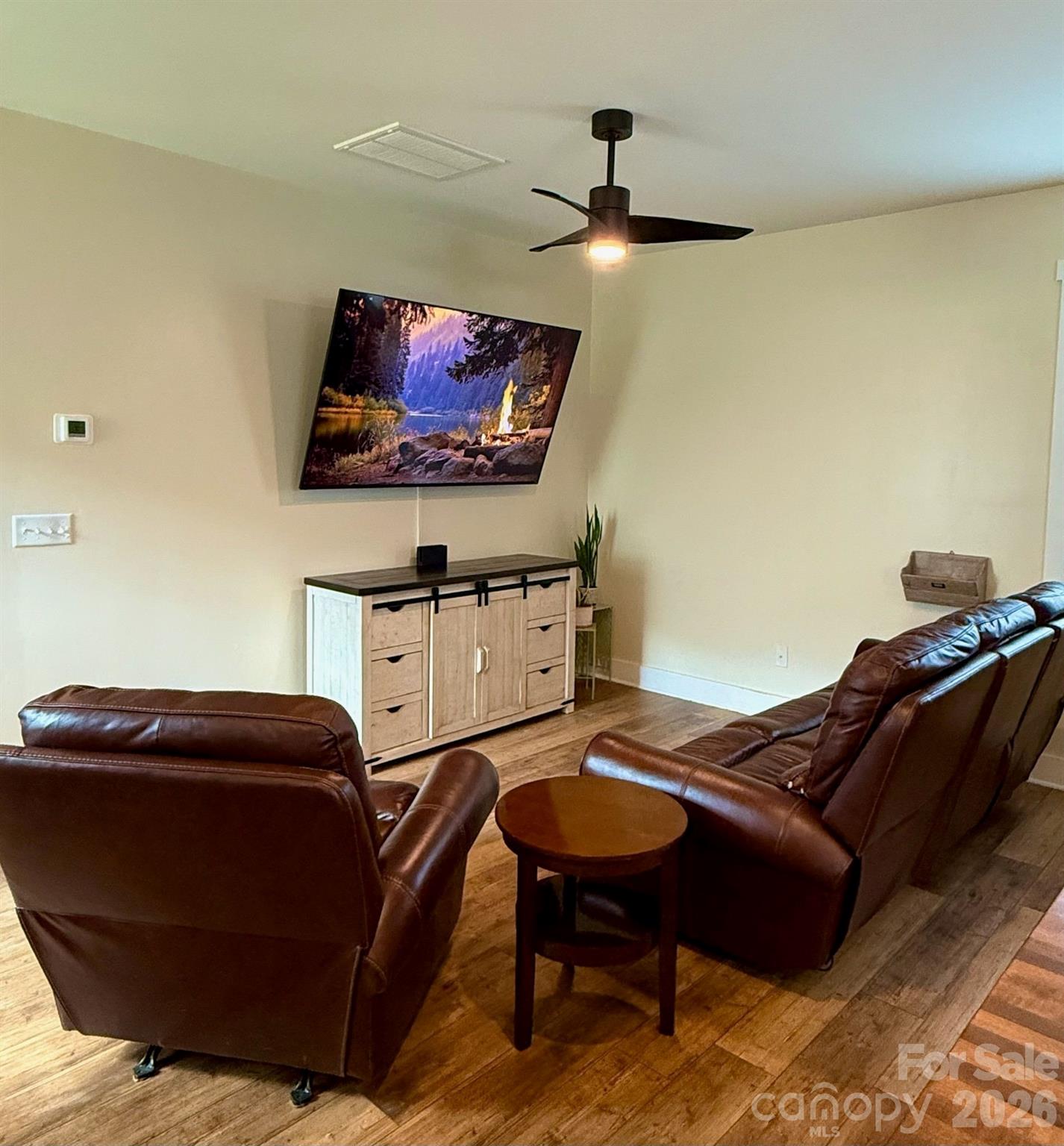 526 Cardwell Lane Fletcher, NC 28732 - Photo 10 of 37 a living room with furniture and a flat screen tv