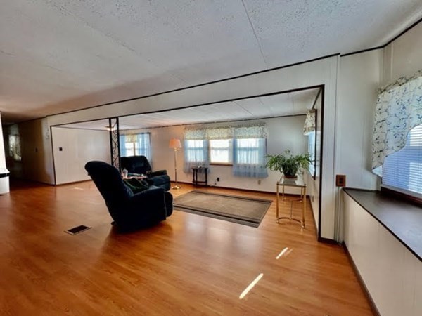 10 St James Circle Hudson, MA 01749 - Photo 4 of 14 a living room with furniture and a large window