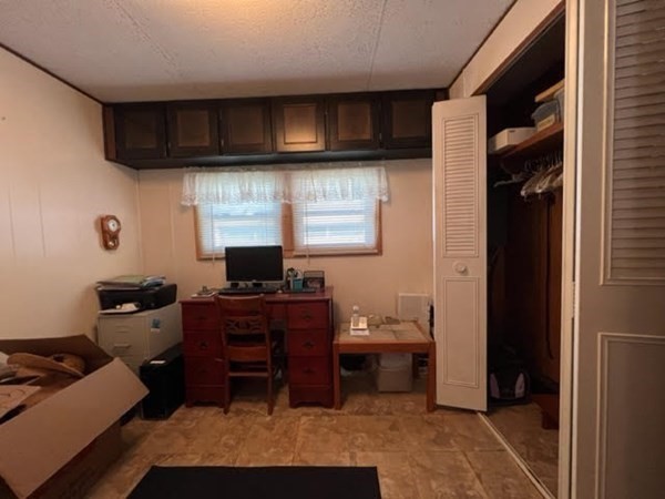 10 St James Circle Hudson, MA 01749 - Photo 7 of 14 a kitchen with a sink cabinets and a window