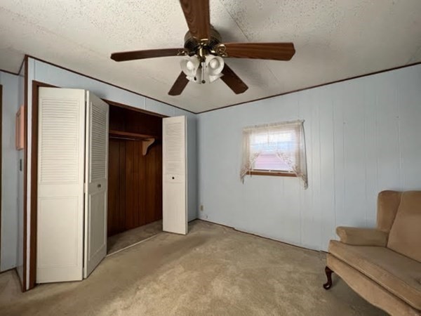 10 St James Circle Hudson, MA 01749 - Photo 10 of 14 a living room with furniture and a ceiling fan