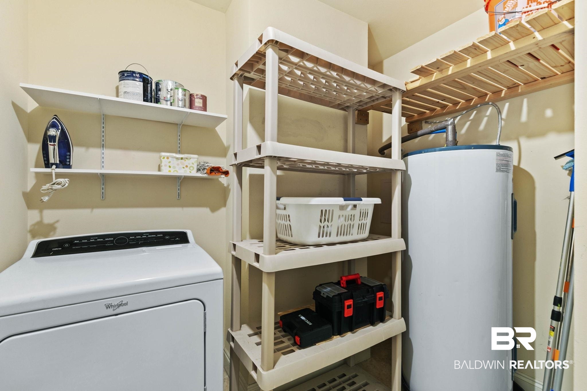 28250 Canal Road, Unit 208 Orange Beach, AL 36561 - Photo 44 of 53 Laundry room with washer / dryer and water heater
