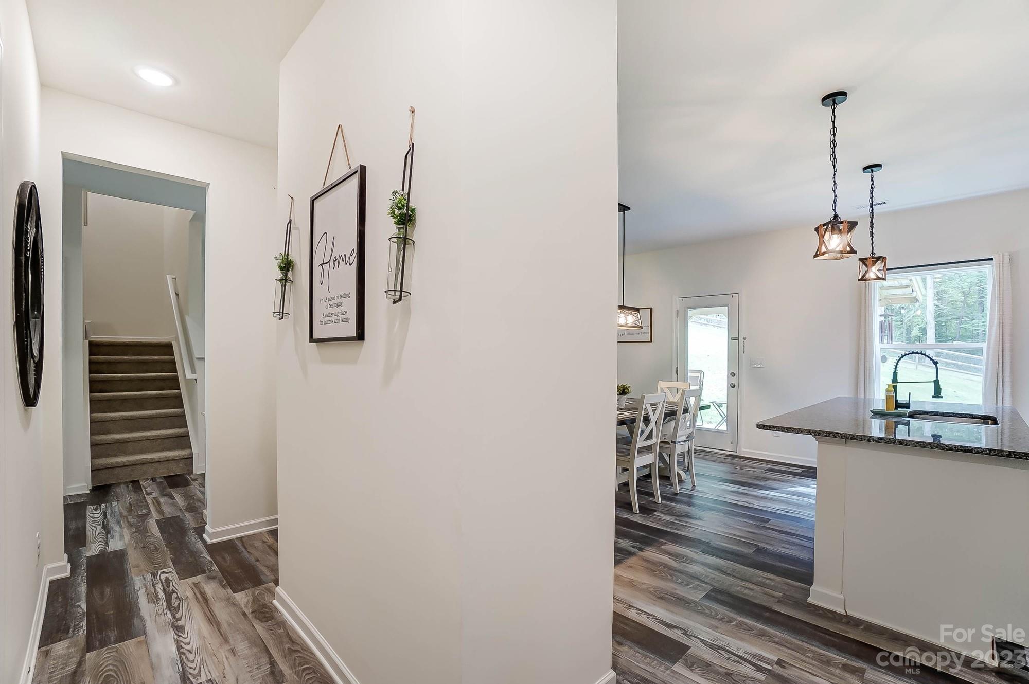 164 Mill Creek Road Iron Station, NC 28080 - Photo 18 of 48 a view of a hallway with furniture and a window