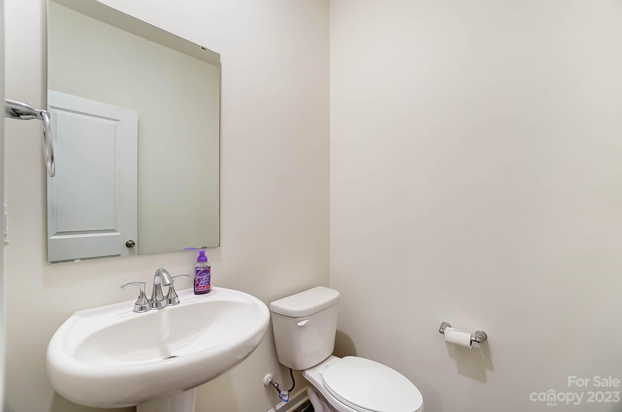 164 Mill Creek Road Iron Station, NC 28080 - Photo 22 of 48 a bathroom with a sink and a mirror