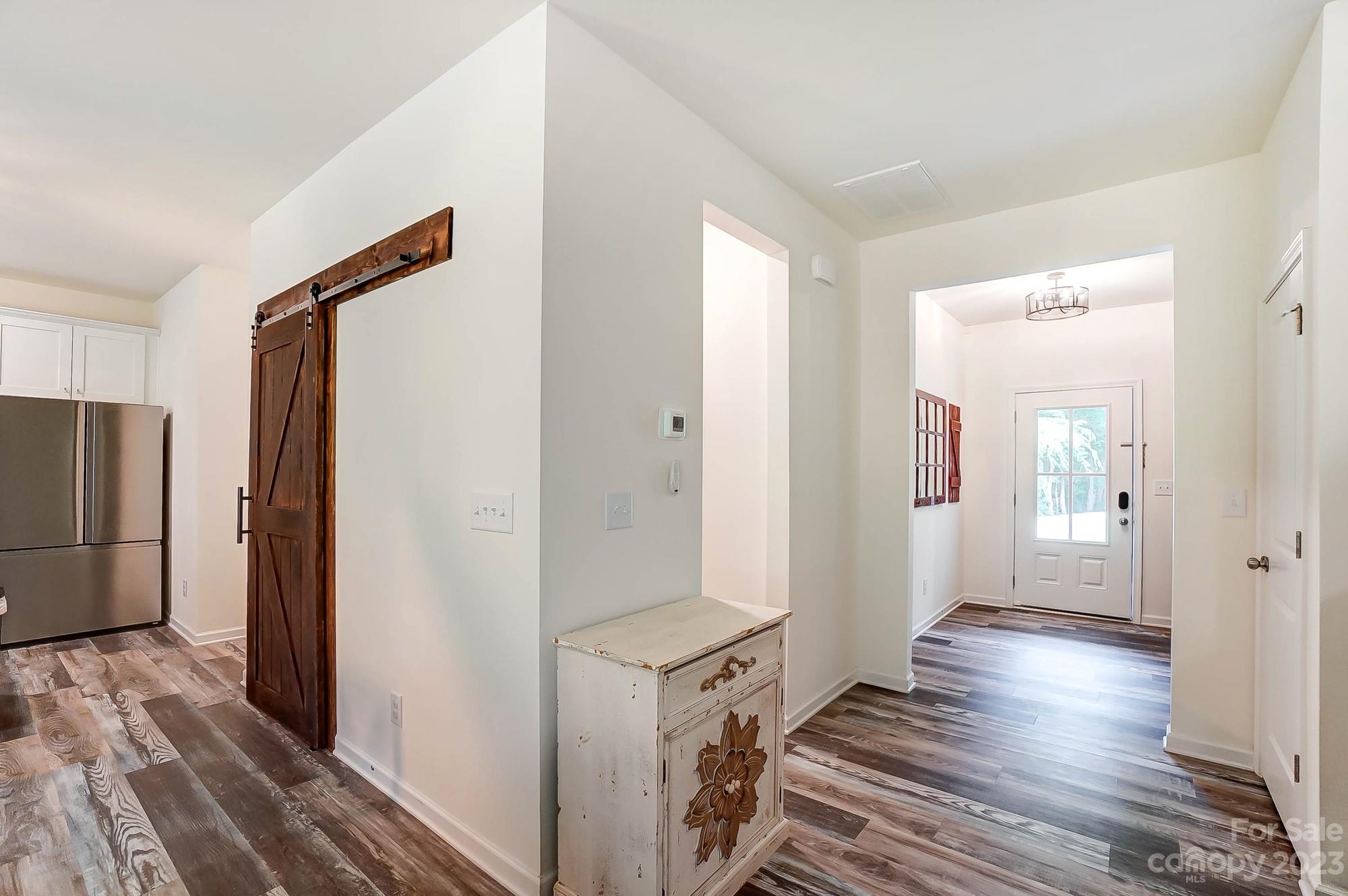 164 Mill Creek Road Iron Station, NC 28080 - Photo 23 of 48 a view of a hallway with wooden floor and staircase