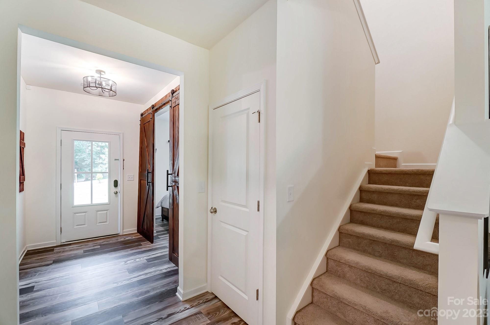 164 Mill Creek Road Iron Station, NC 28080 - Photo 24 of 48 a view of a hallway with wooden floor and entryway