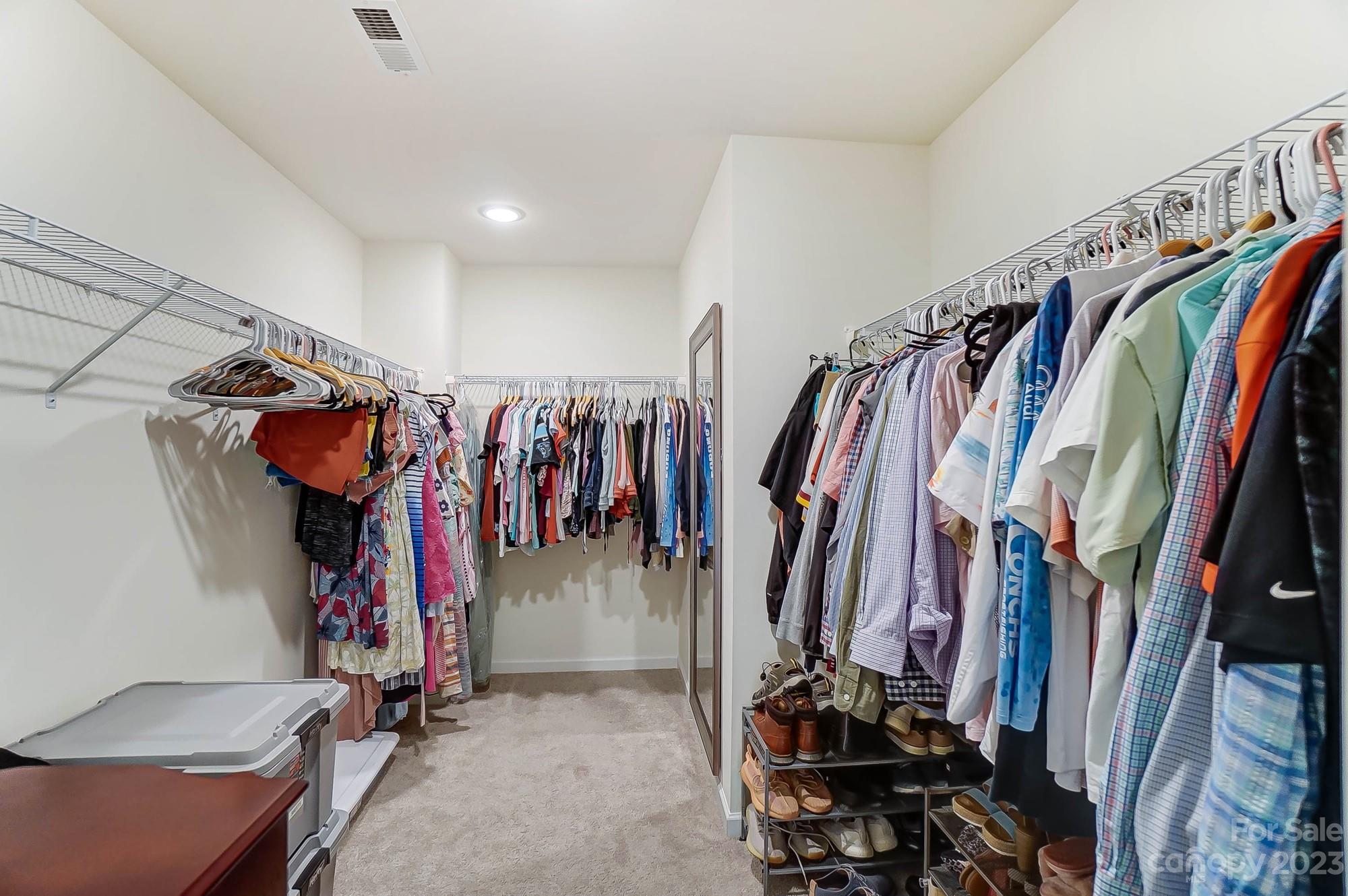 164 Mill Creek Road Iron Station, NC 28080 - Photo 33 of 48 a view of walk in closet with clothes