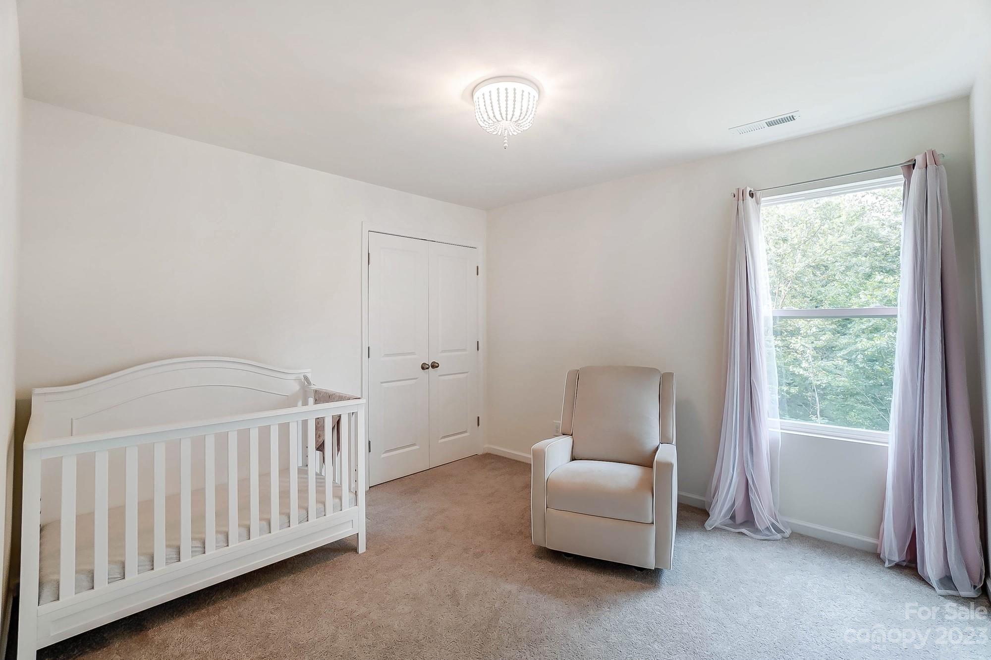 164 Mill Creek Road Iron Station, NC 28080 - Photo 39 of 48 a bedroom with furniture and a window