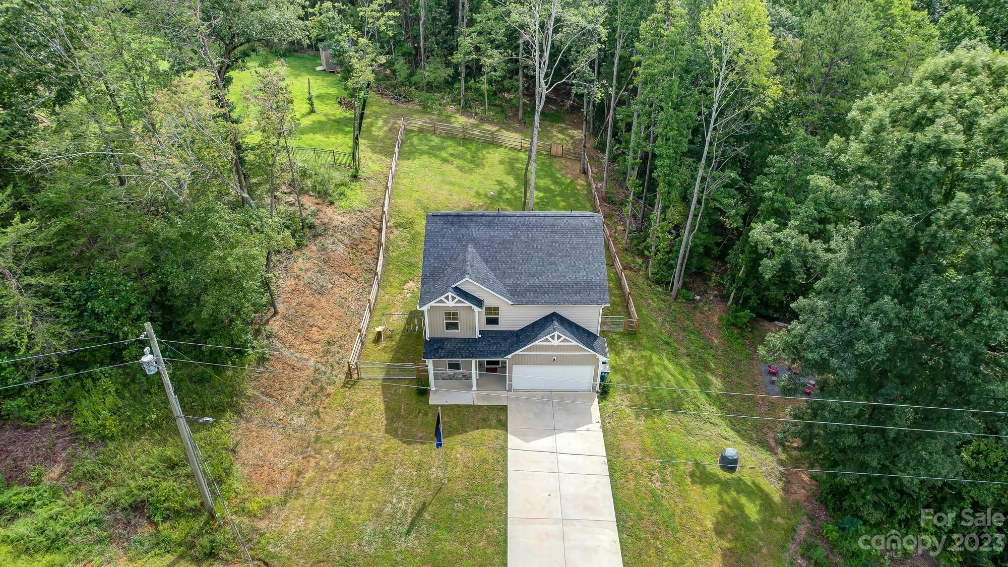 164 Mill Creek Road Iron Station, NC 28080 - Photo 4 of 48 an aerial view of a house with a yard