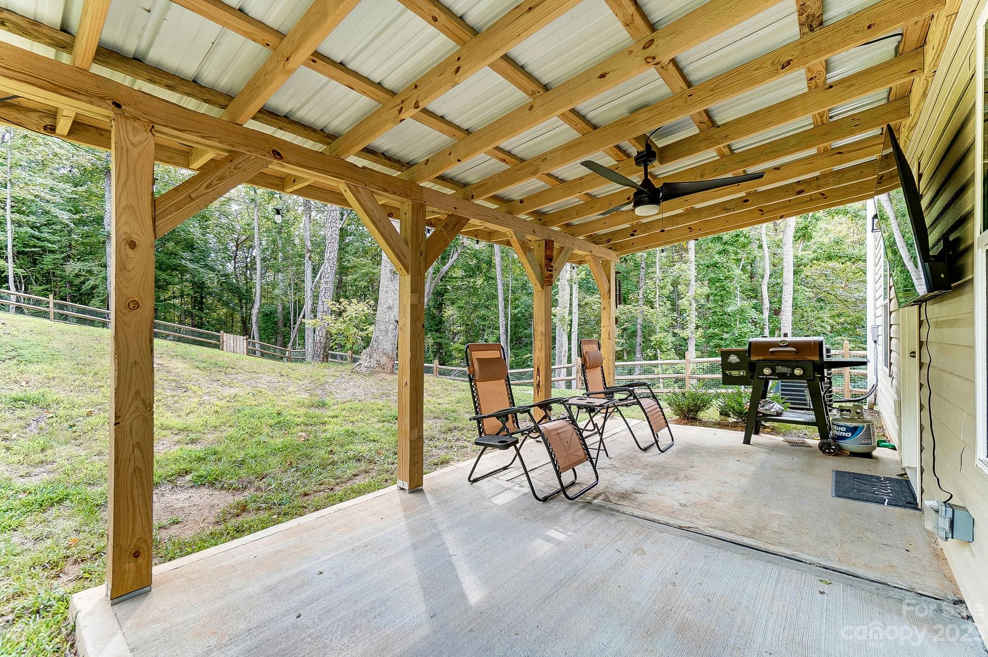 164 Mill Creek Road Iron Station, NC 28080 - Photo 44 of 48 a view of a porch with furniture and a yard