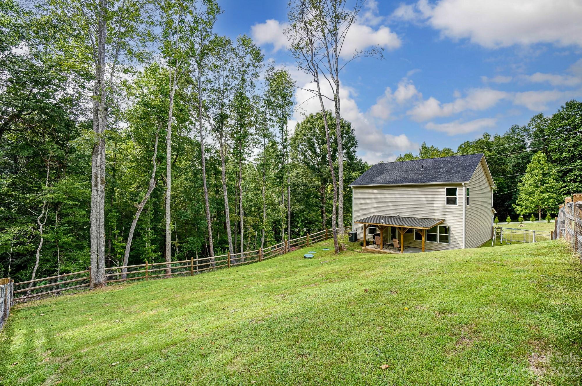 164 Mill Creek Road Iron Station, NC 28080 - Photo 46 of 48 a view of a house with a big yard and sitting area
