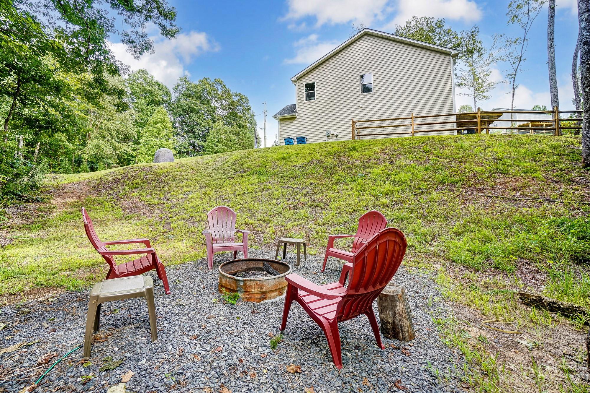 164 Mill Creek Road Iron Station, NC 28080 - Photo 48 of 48 a backyard of a house with table and chairs