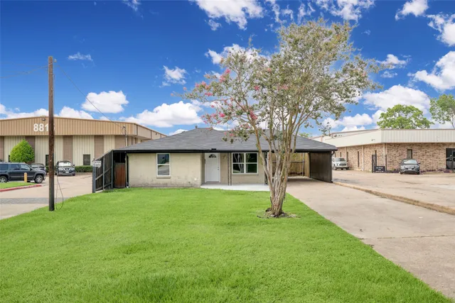 a house with a tree in front of it