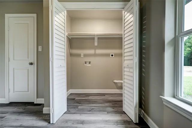 a view of front door with wooden floor