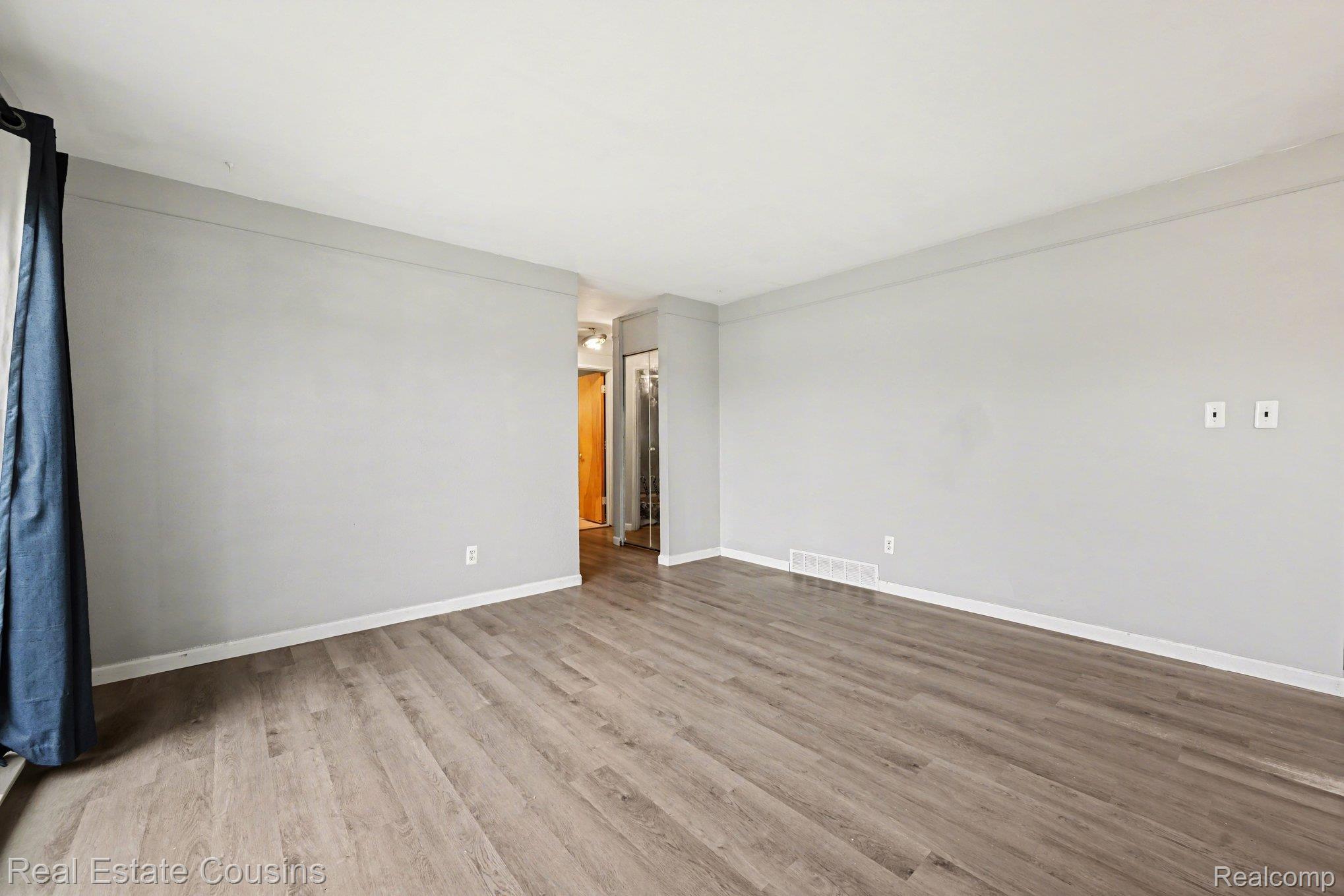 32224 Joy Road Livonia, MI 48150 - Photo 6 of 33 Unfurnished room with light wood-style floors and baseboards