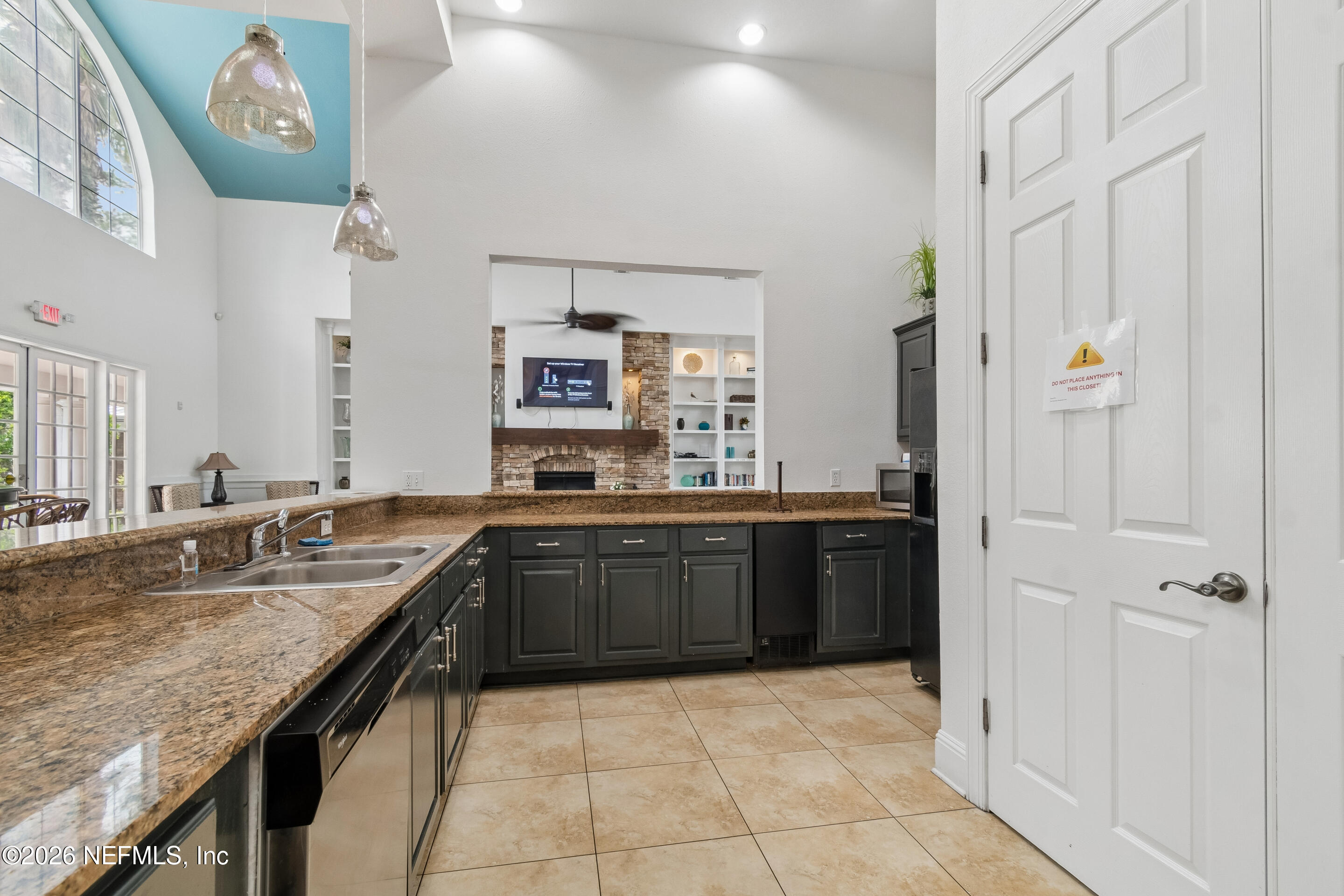 8550 Touchton Road, Unit 511 Jacksonville, FL 32216 - Photo 55 of 63 a large kitchen with a granite countertop cabinets and a sink