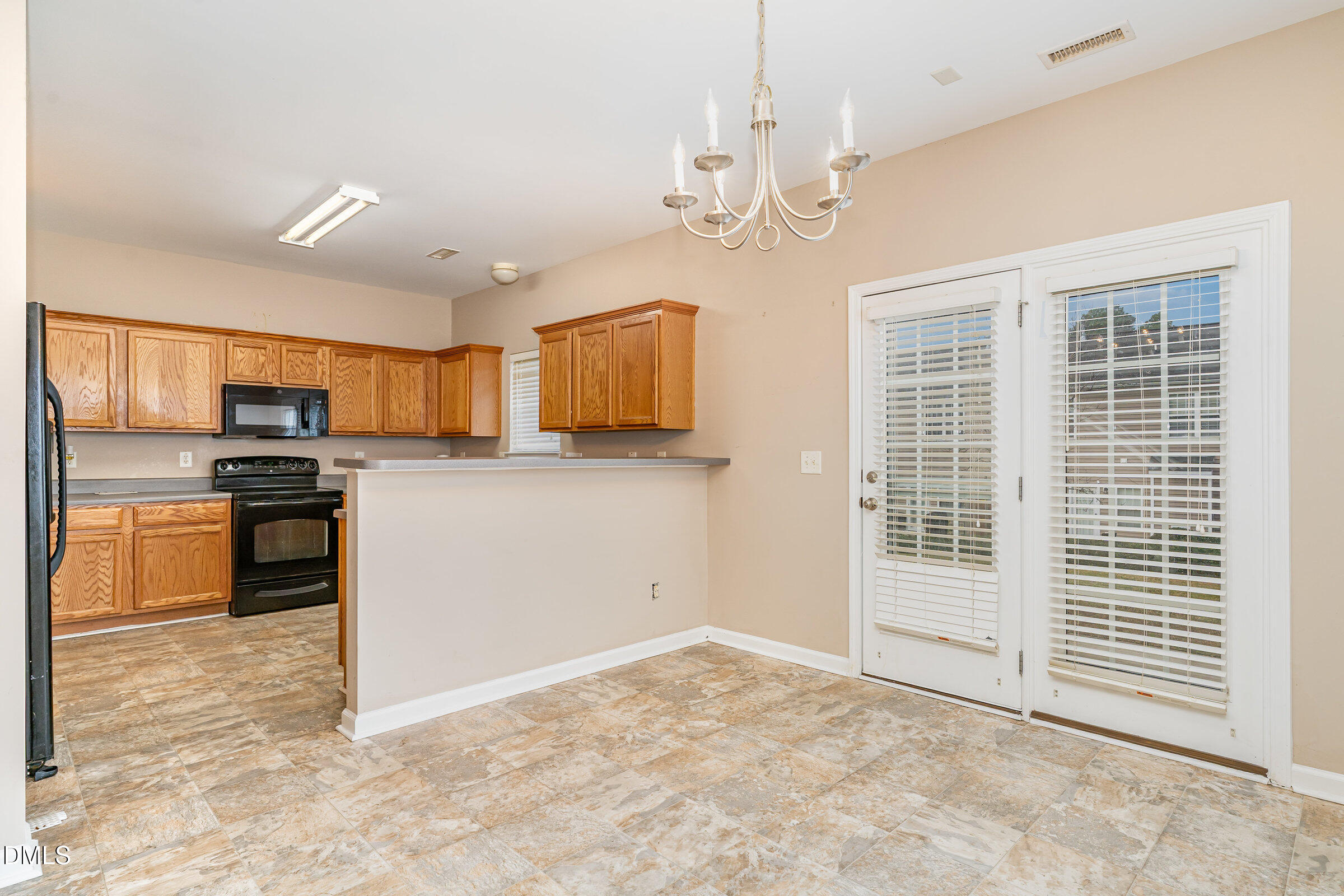 3531 Oneonta Avenue Raleigh, NC 27604 - Photo 11 of 32 a view of a kitchen with stove and dishwasher
