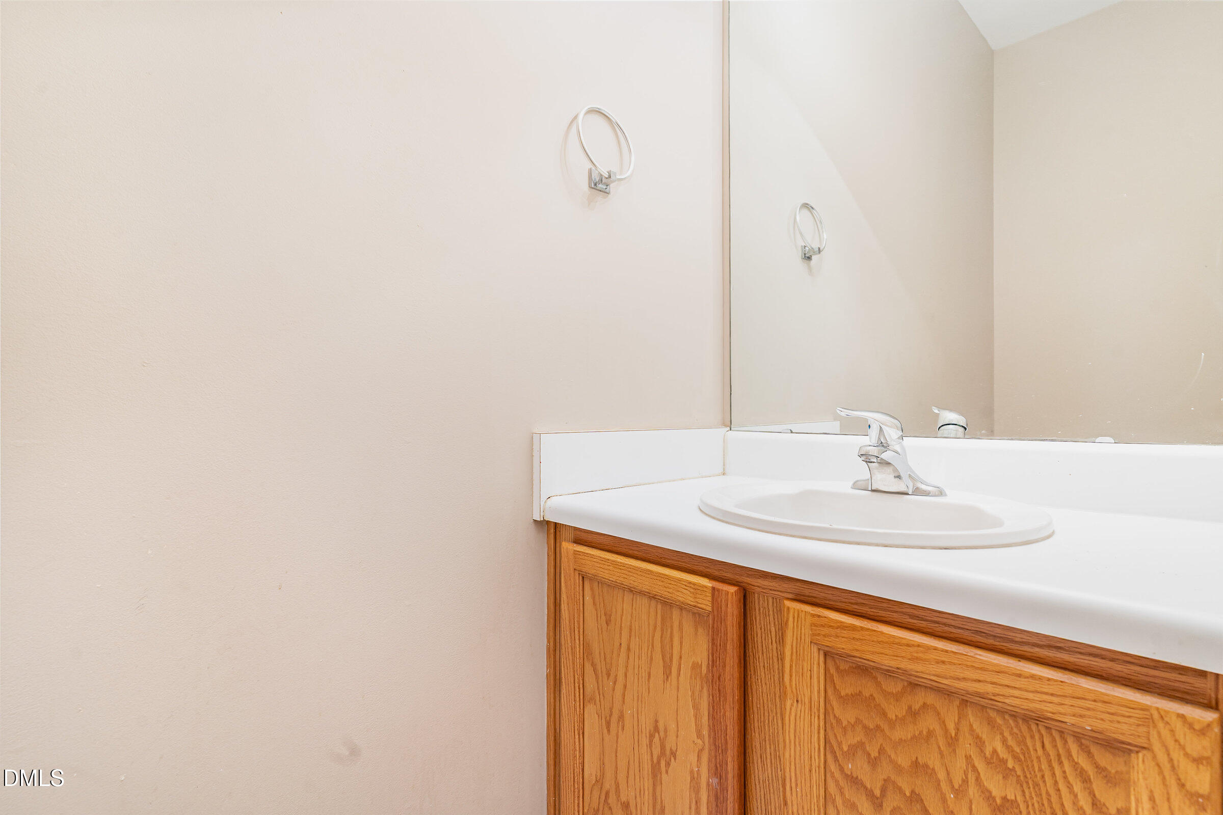 3531 Oneonta Avenue Raleigh, NC 27604 - Photo 16 of 32 a bathroom with a sink and a mirror