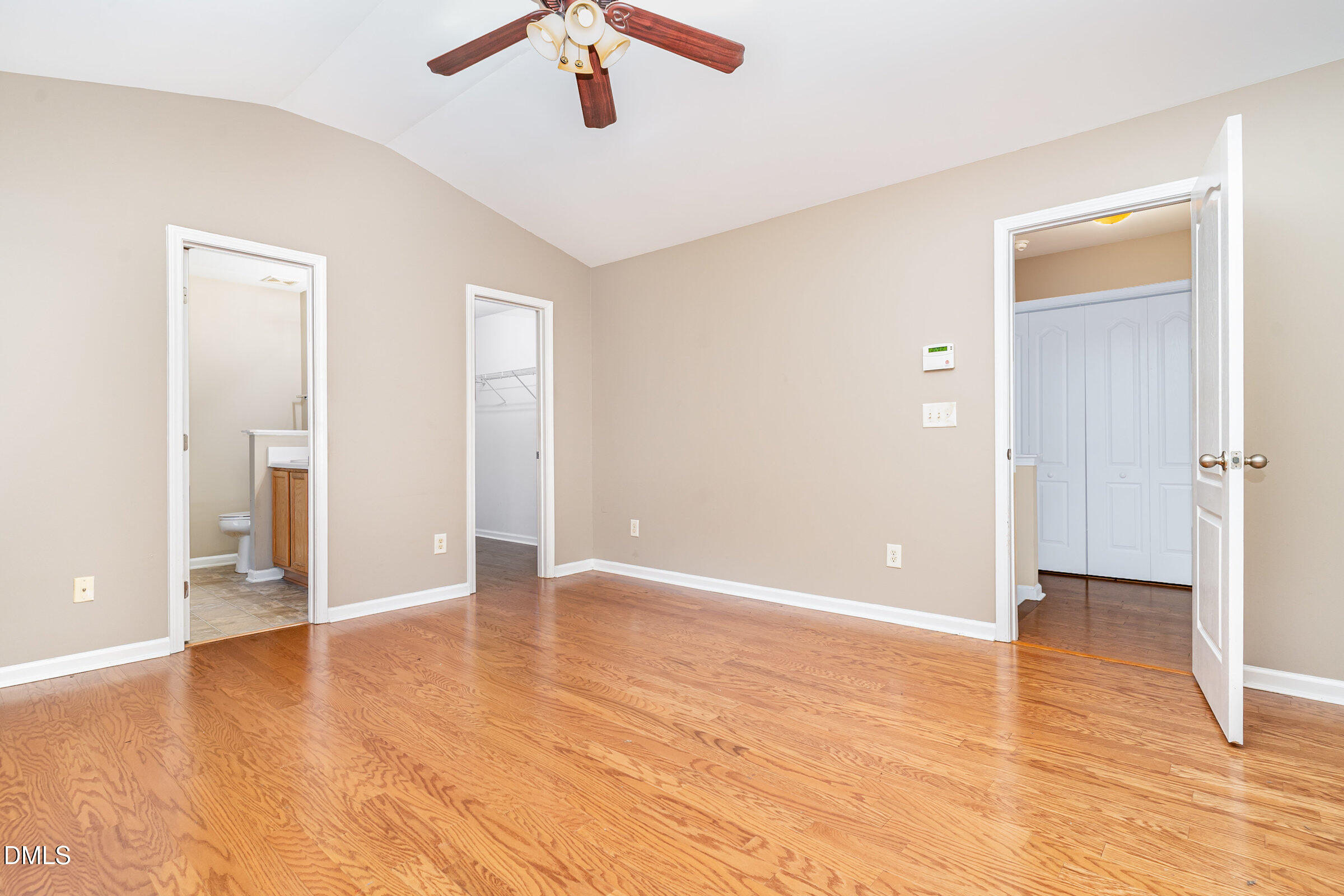 3531 Oneonta Avenue Raleigh, NC 27604 - Photo 21 of 32 an empty room with wooden floor and ceiling fan