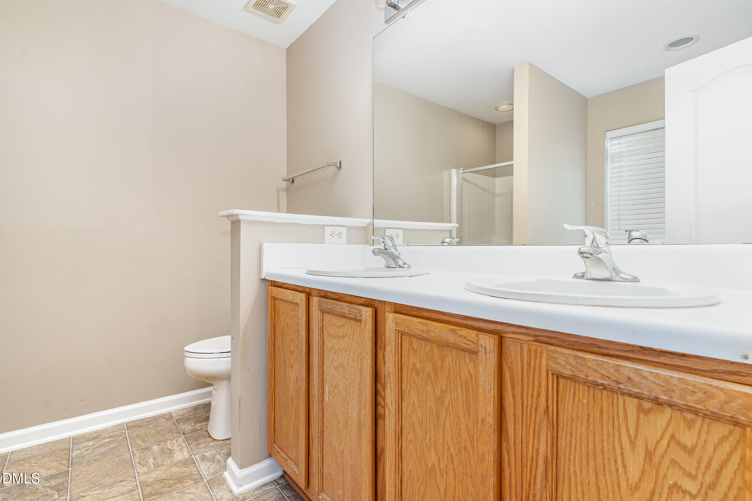 3531 Oneonta Avenue Raleigh, NC 27604 - Photo 22 of 32 a bathroom with a sink and a mirror