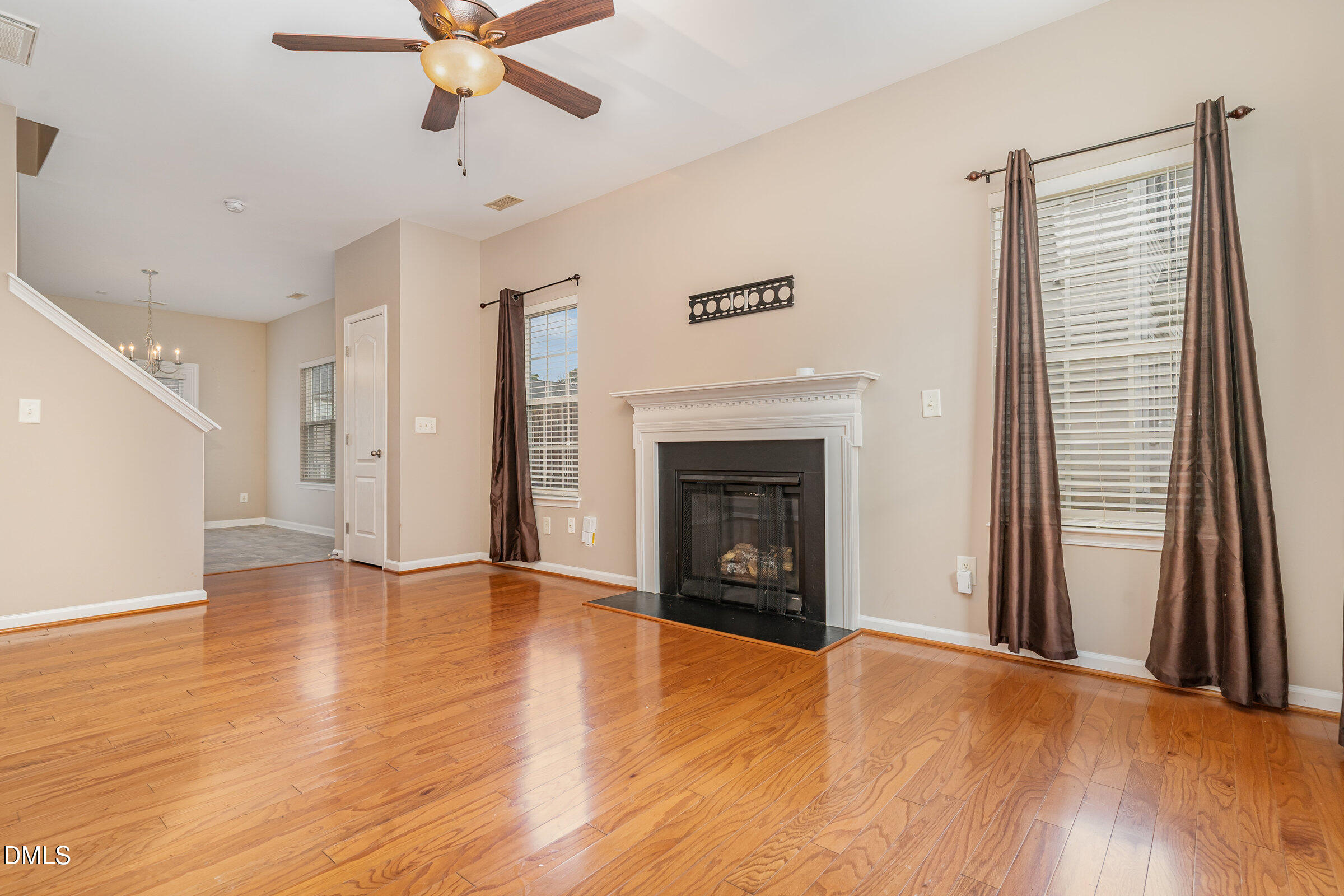 3531 Oneonta Avenue Raleigh, NC 27604 - Photo 7 of 32 a view of an empty room with a fireplace and a window
