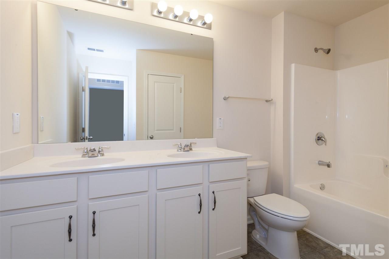 728 Maple Brook Road Fuquay-Varina, NC 27526 - Photo 20 of 25 *Not actual home* Home will have antique white cabinets, cultured marble countertops and brushed nickle fixtures.