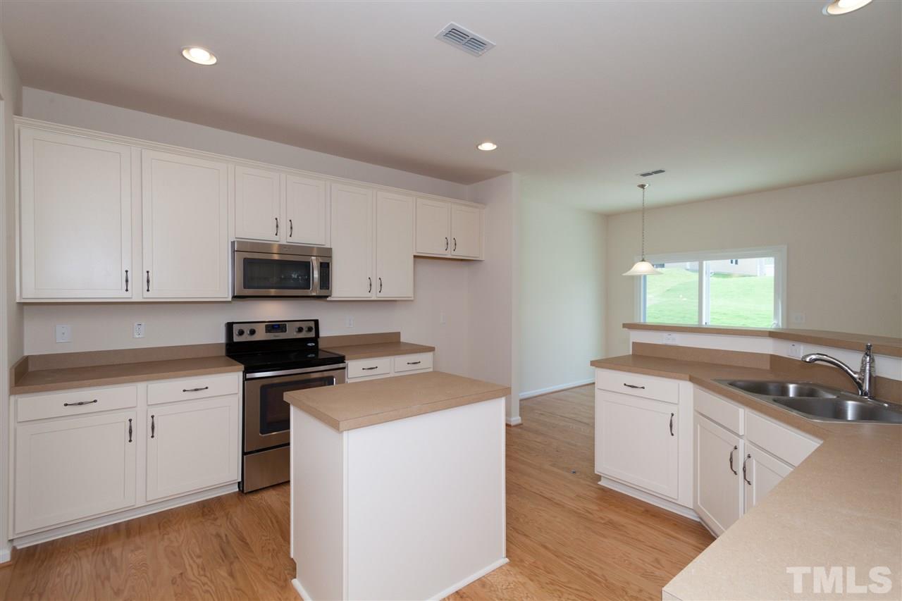 728 Maple Brook Road Fuquay-Varina, NC 27526 - Photo 5 of 25 *Not actual home* Home will have upgraded antique white cabinetry with granite countertops!