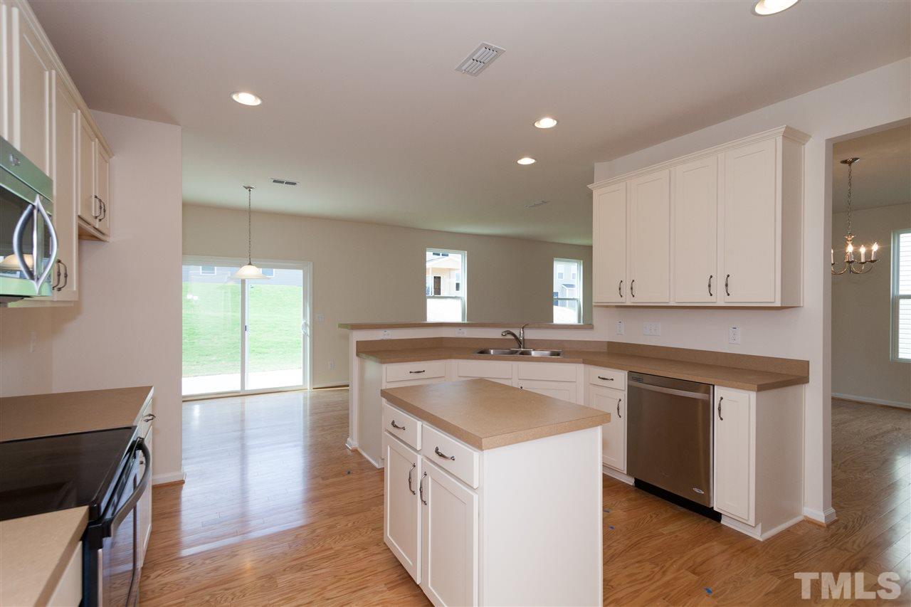 728 Maple Brook Road Fuquay-Varina, NC 27526 - Photo 6 of 25 *Not actual home* Plenty of room for cooking with tons of cabinet storage and countertop space.