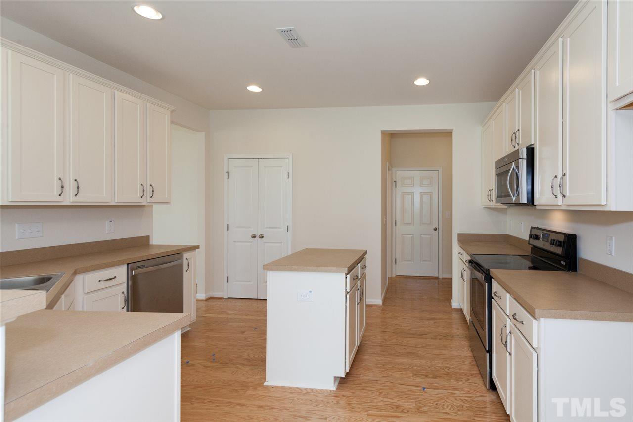 728 Maple Brook Road Fuquay-Varina, NC 27526 - Photo 8 of 25 *Not actual home* Actual kitchen will have upgraded cabinetry with granite countertops plus island.