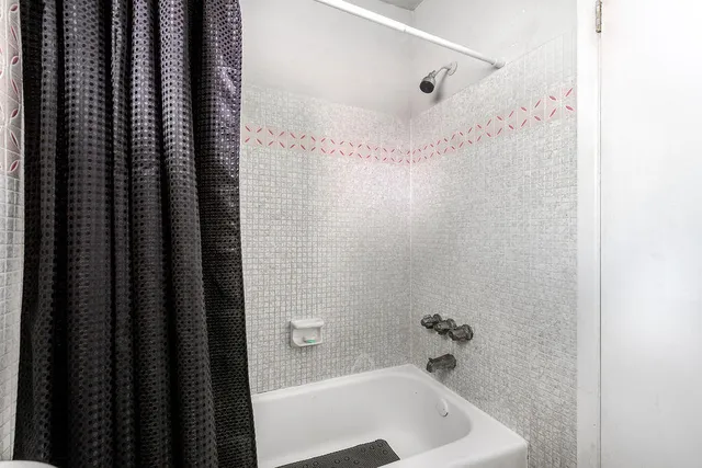 a bathroom with a bathtub