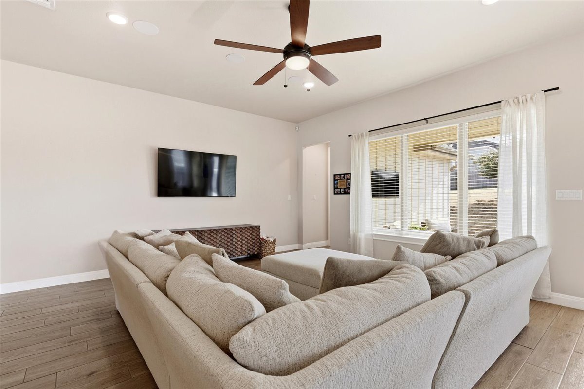304 Morning Ridge Georgetown, TX 78628 - Photo 16 of 31 Living room with light wood-style flooring, ceiling fan, and recessed lighting