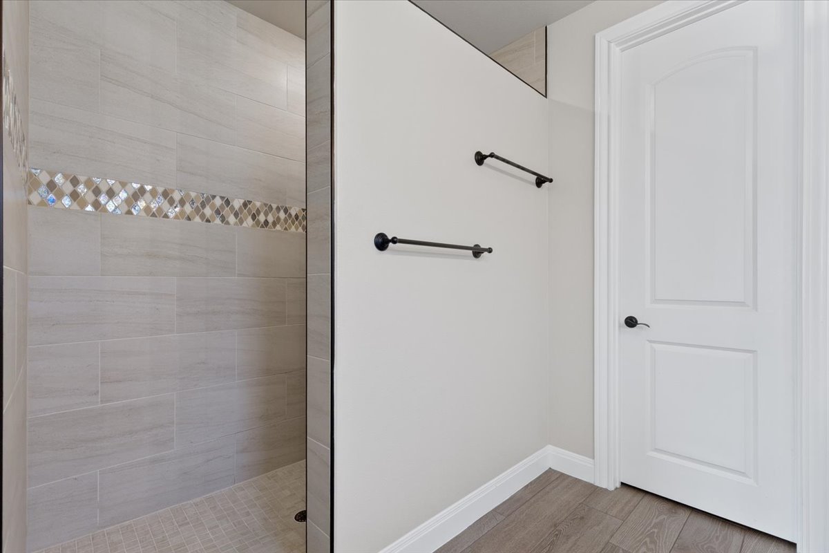 304 Morning Ridge Georgetown, TX 78628 - Photo 22 of 31 Bathroom with walk in shower and light wood-style flooring