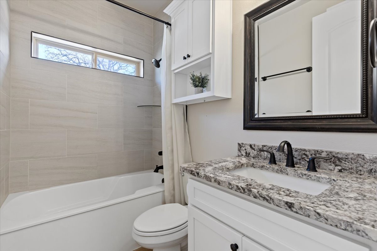304 Morning Ridge Georgetown, TX 78628 - Photo 24 of 31 Full bathroom featuring shower / bath combo with shower curtain and vanity
