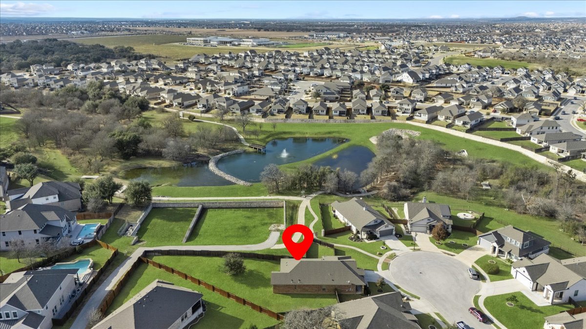 304 Morning Ridge Georgetown, TX 78628 - Photo 3 of 31 Aerial view of property and surrounding area with nearby suburban area and a large body of water
